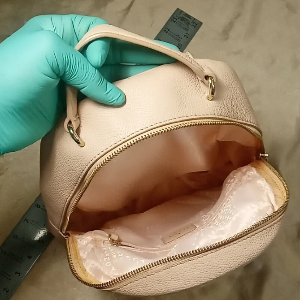 Kate Spade Elegant Pink Cream Backpack with gold Hardware